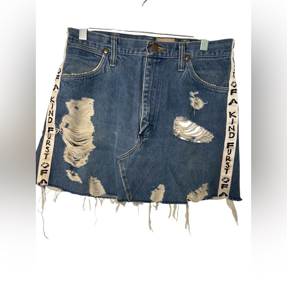 Furst of a Kind Distressed Denim Skirt with Unique Side Straps